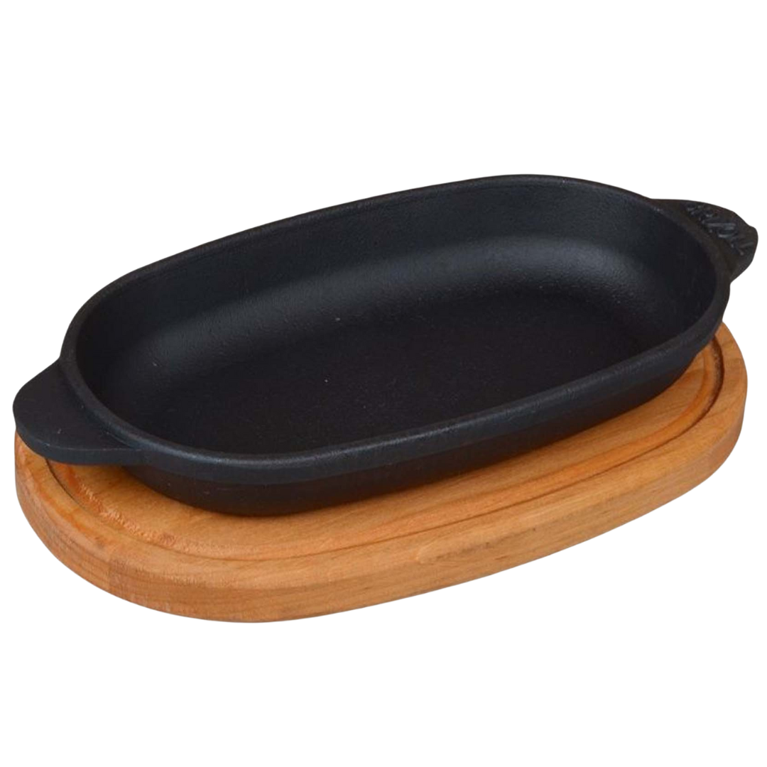 Ovale Servierpfanne aus Gusseisen mit Holzablage